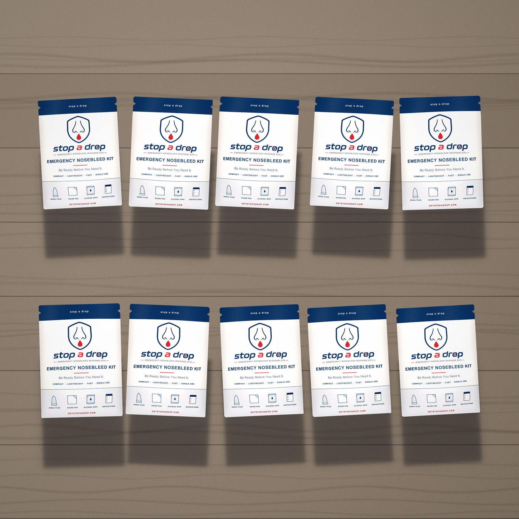 Ten Stop A Drop emergency nosebleed kits arranged in a grid